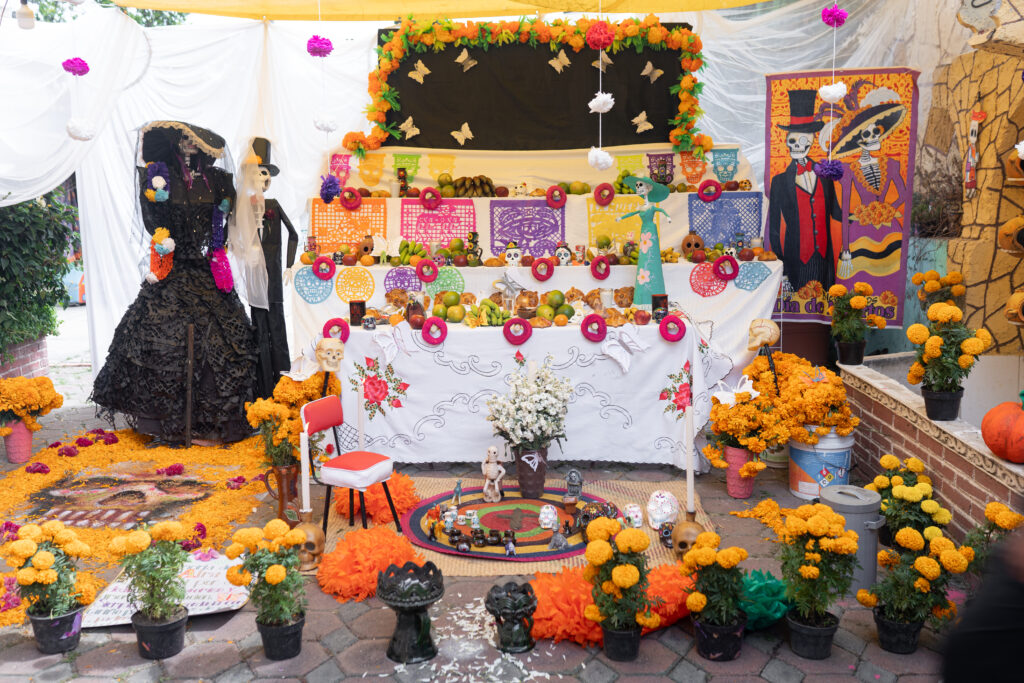 Traditional decorated Day of the Dead altar in Mexico flor de cempasúchil